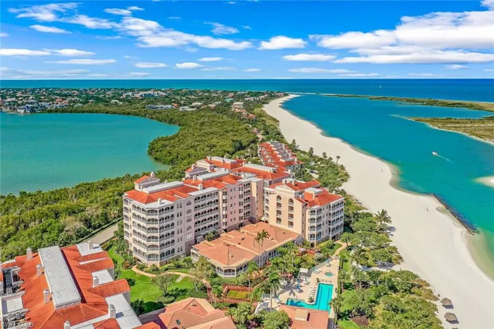 Drone / aerial view featuring a view of the beach and a water view