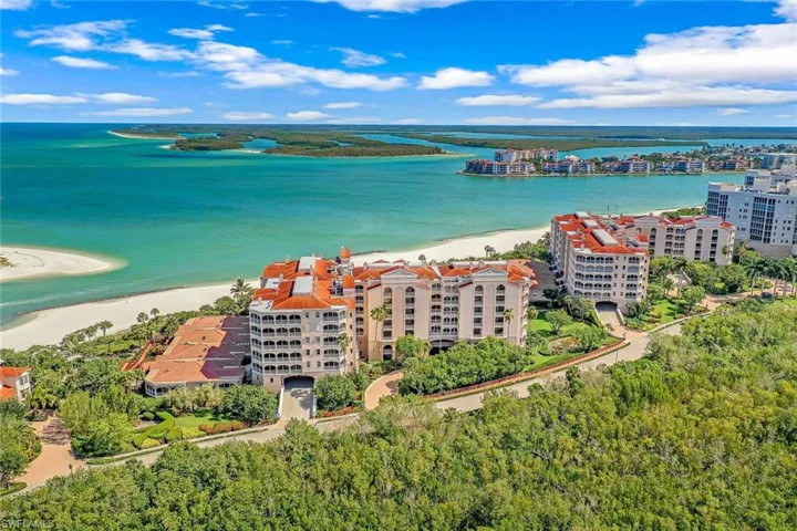 Bird's eye view with a view of the beach and a water view