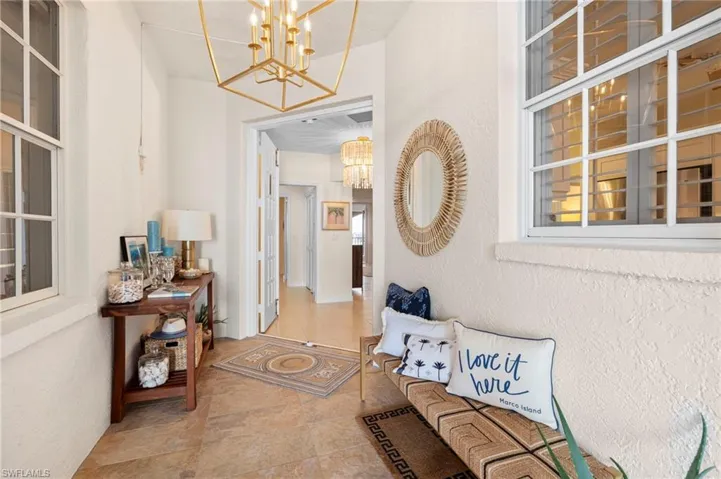 Hallway with a chandelier