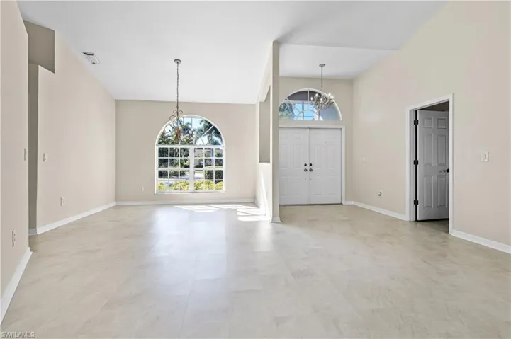 Foyer featuring a chandelier and a high ceiling