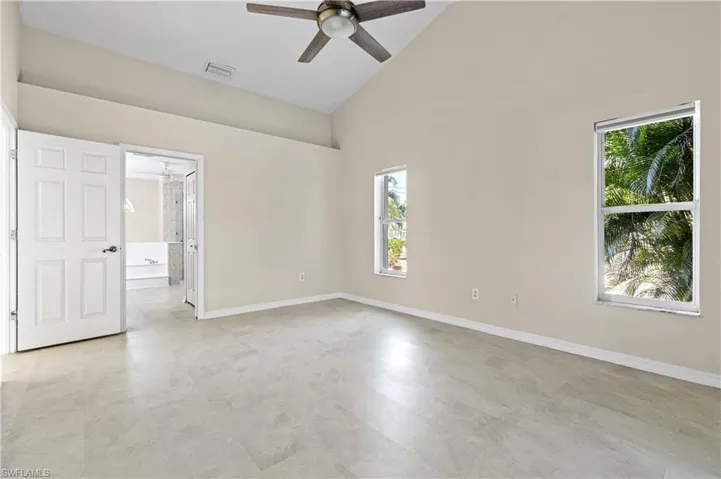 Master Bedroom with ceiling fan and high vaulted ceiling