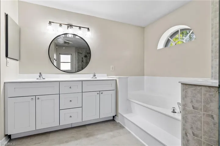 Master bath with double vanity and soaking tub