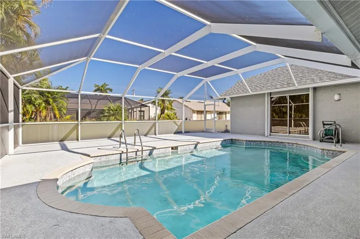 Swimming pool featuring a large outdoor lounging area