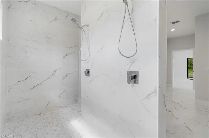 Bathroom featuring a tile shower