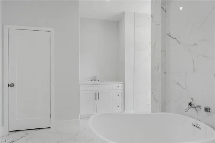 Bathroom with vanity and tile patterned flooring