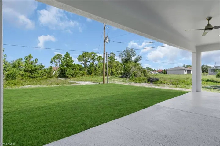 View of yard featuring ceiling fan