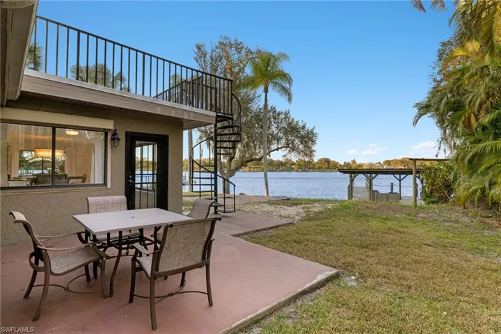 View of patio with a water view