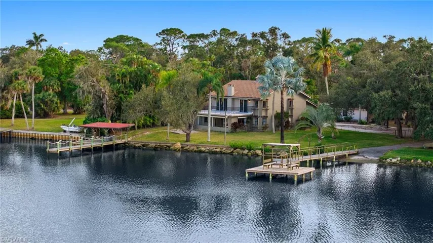 View of water feature with a dock