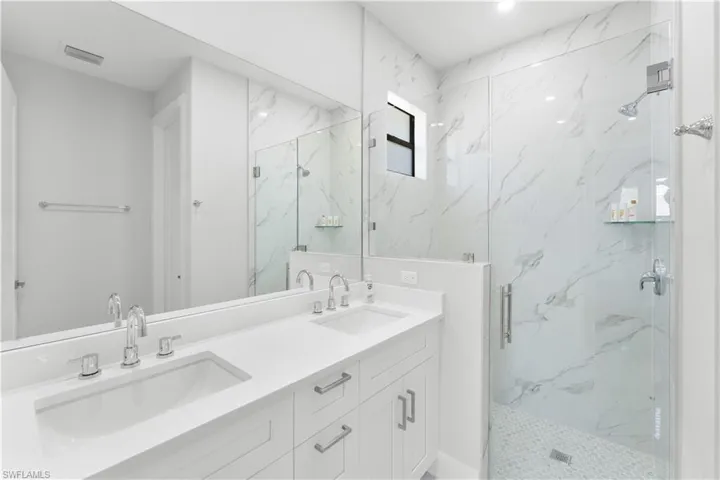 Double vanity with integrated sinks and chrome fixtures