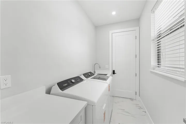 Laundry area with utility sink and ample counter space