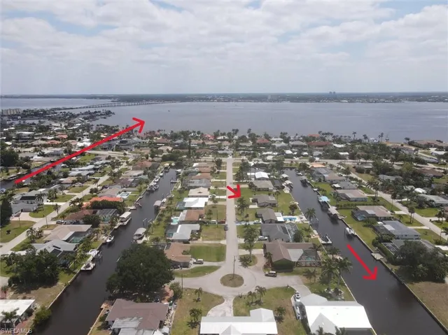 Aerial view featuring a water view and a residential view