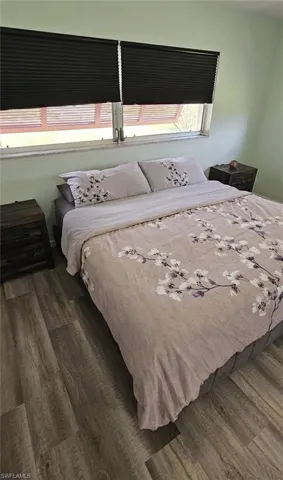 Bedroom with wood finished floors