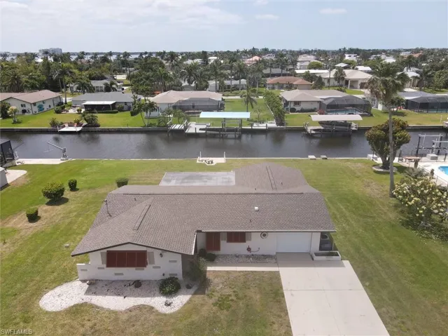 Bird's eye view with a water view and a residential view