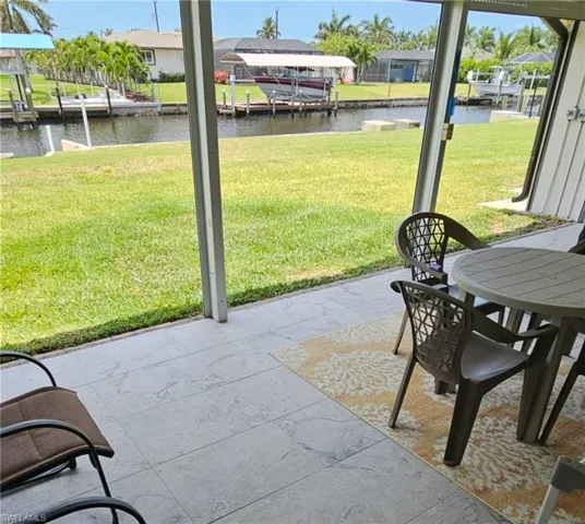 View of patio / terrace featuring a residential view and a water view