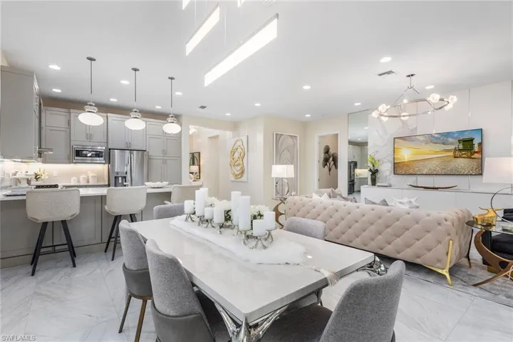 Dining space featuring marble finish floor, visible vents, and recessed lighting