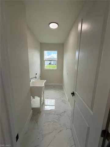 Bathroom with marble finish floors