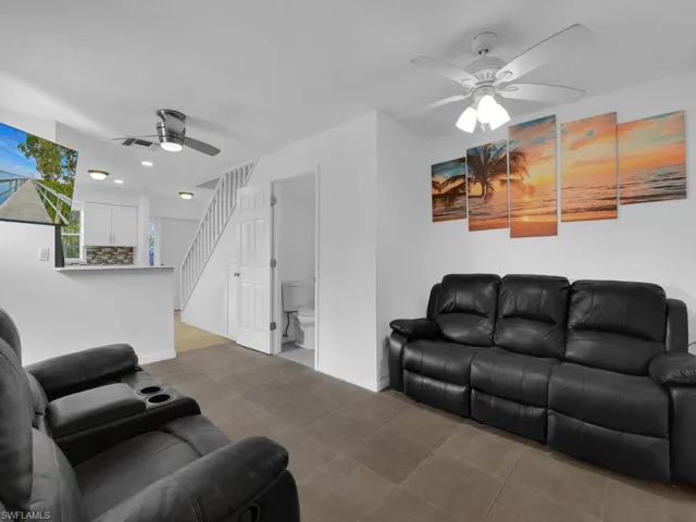 Living area featuring a ceiling fan and recessed lighting