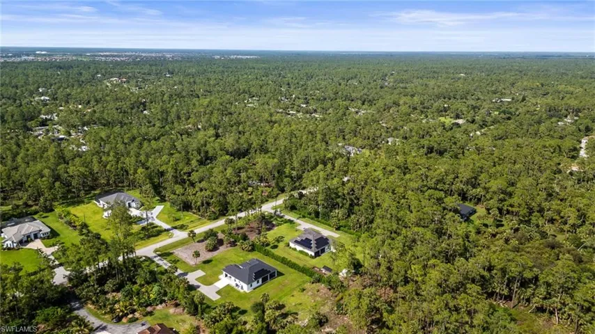 View of property location featuring a heavily wooded area