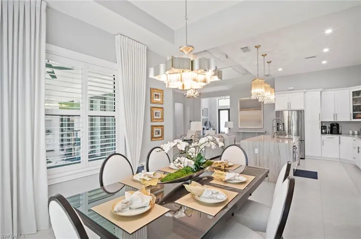 Dining space featuring a chandelier, recessed lighting, and light tile patterned floors