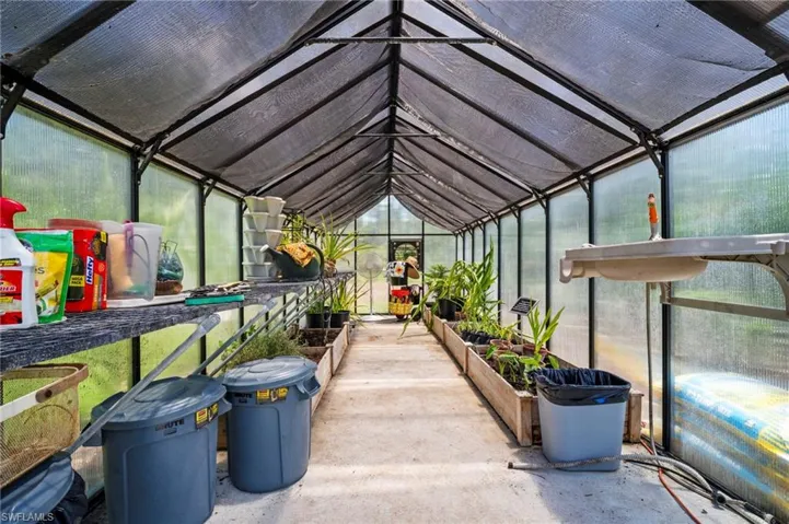 Sunroom featuring lofted ceiling