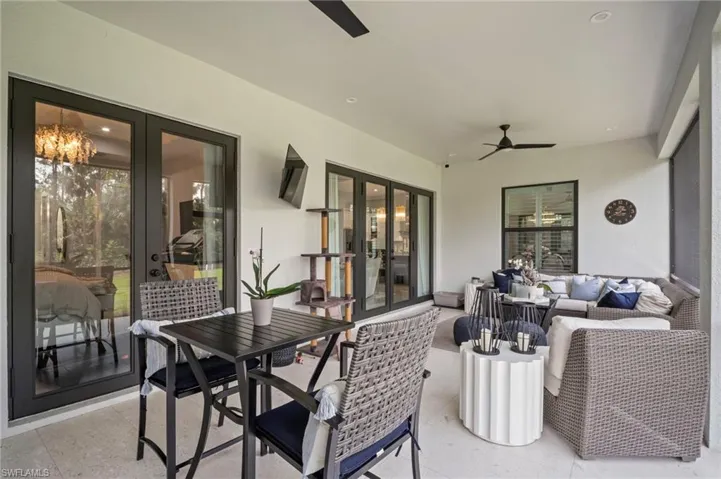 View of patio / terrace featuring french doors, ceiling fan, and an outdoor living space