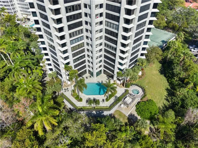 Aerial view of a pool and apartment complex
