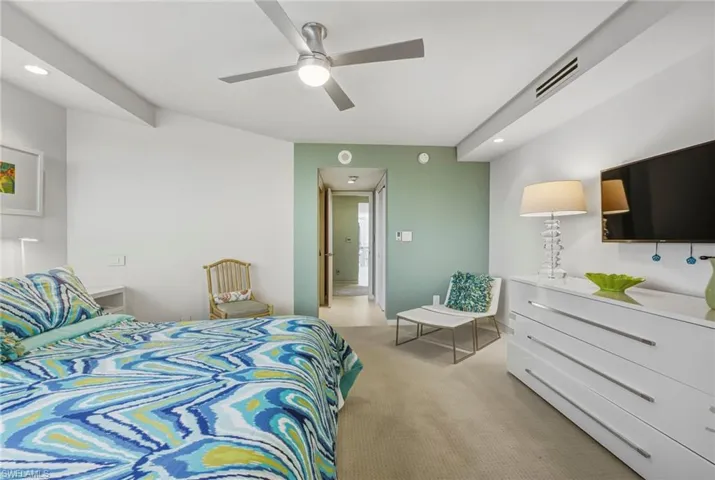 Bedroom featuring recessed lighting, a ceiling fan, and light colored carpet