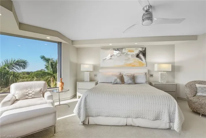 Carpeted bedroom with recessed lighting and ceiling fan