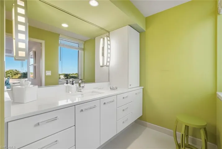 Bathroom with vanity and recessed lighting