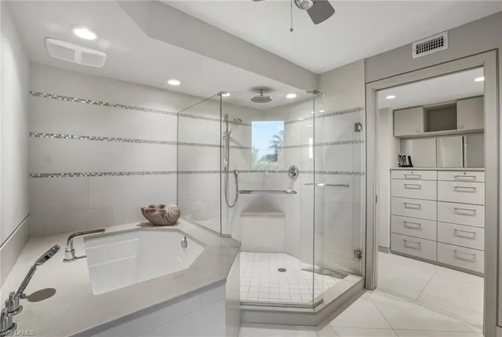 Bathroom with a stall shower, ceiling fan, light tile patterned floors, recessed lighting, and a garden tub
