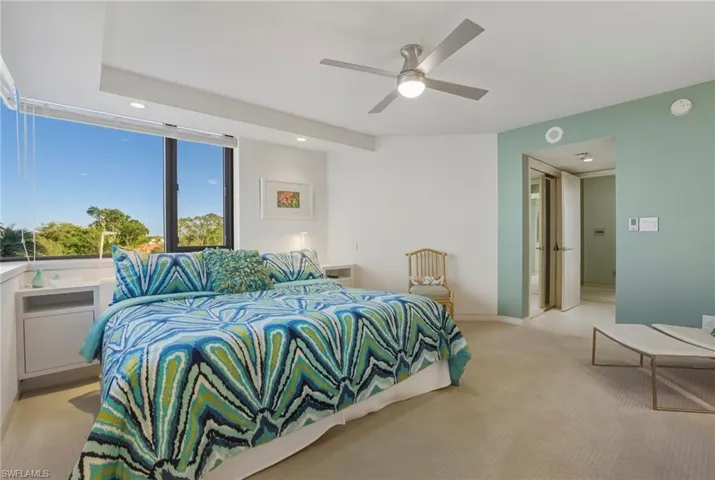 Bedroom featuring light carpet, connected bathroom, recessed lighting, and a ceiling fan