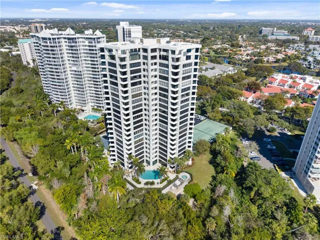 Aerial view of a pool area and apartment complex