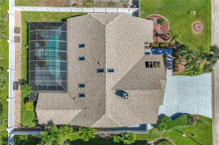 Wide Driveway and Fenced Yard