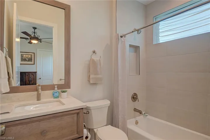 Full bath with shower / bathtub combination with curtain and vanity