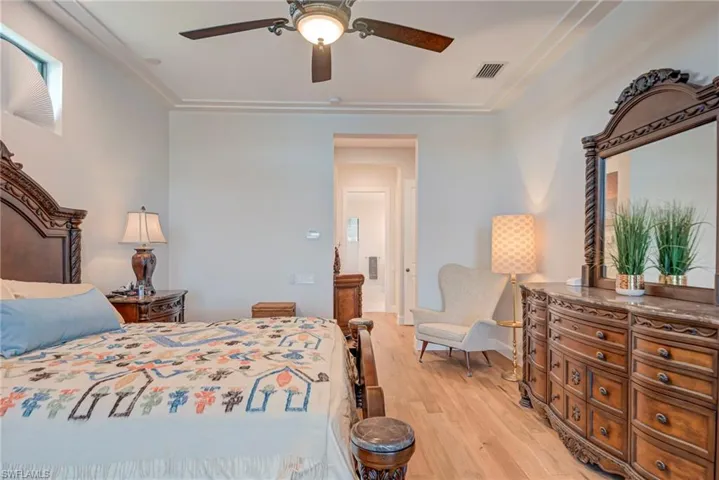 Bedroom with light wood-style flooring and ceiling fan