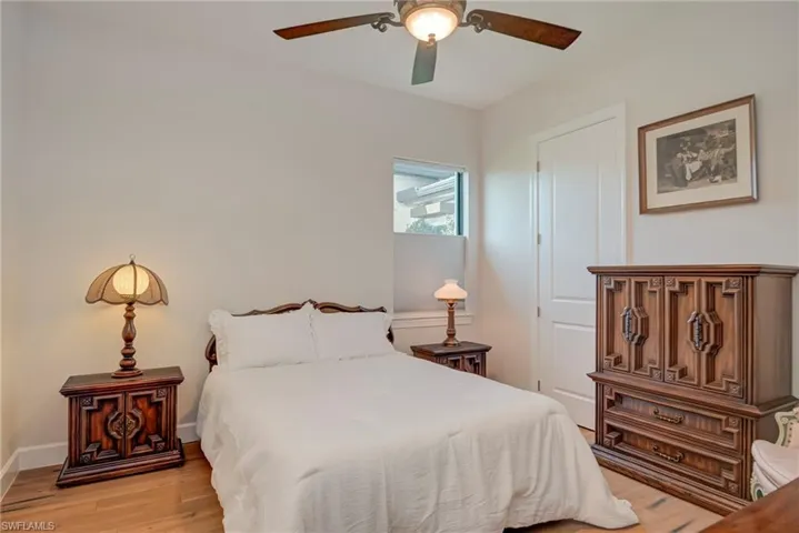 Bedroom with light wood-type flooring and ceiling fan
