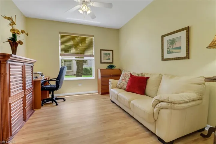Den with laminate flooring, large south facing window, sleeper sofa