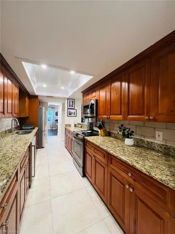 Very Large Galley Style Kitchen with Stainless Steele Appliances.