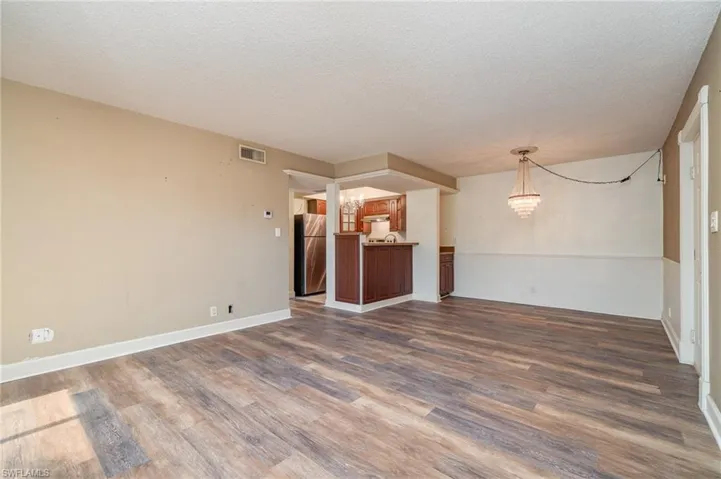 Living room view towards dining and kitchen