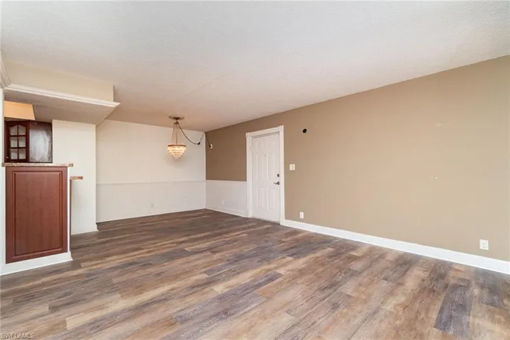 Living room view towards dining and kitchen