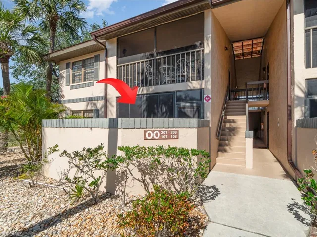 Arrow pointing to screened in lanai of 19505 Quesada Ave - Building oo - unit o107