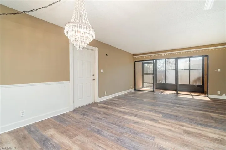 Virtually staged for decorating ideas - Dining room view to living room and screened in lanai