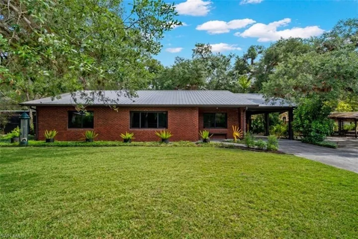 412 Fraser Ave LaBelle3-Bedroom, 2 Bath Brick Facade Home with Metal roof on .71 Acres.