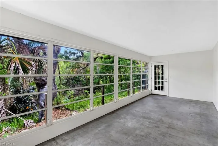 Florida room  digitally altered to show blank canvas for potential additional living space.