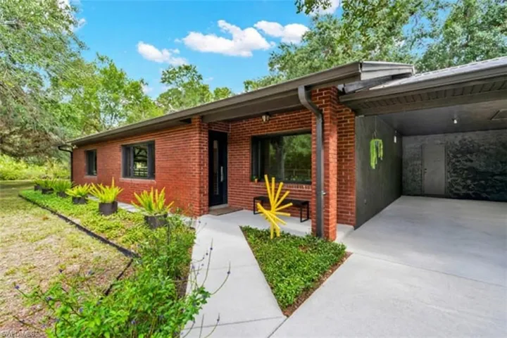 Front walkway leads to the entrance door and covered front porch area.