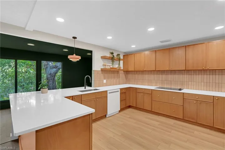 Kitchen opens to the family room, ample counter workspace and bar seating.