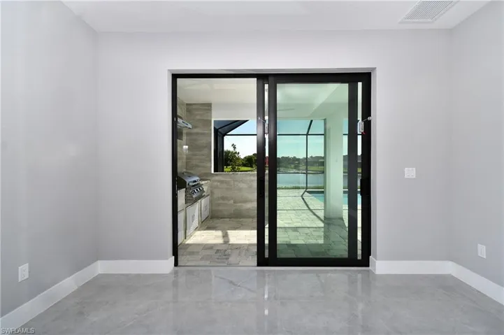 Doorway featuring tile patterned flooring
