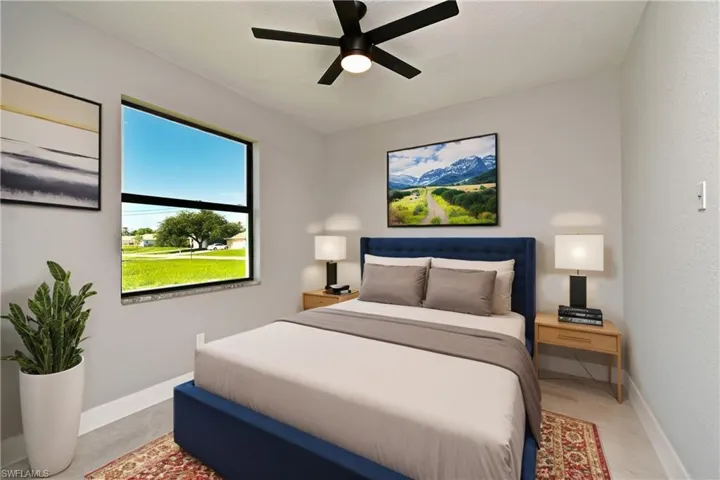 Bedroom with light hardwood / wood-style floors and ceiling fan