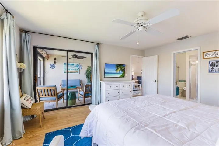Primary bedroom with access to the screened in lanai
