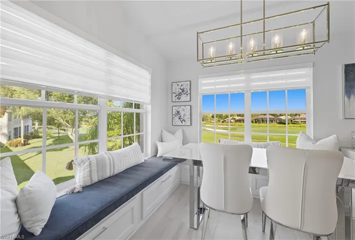 Dining area featuring breakfast area, plenty of natural light, and a residential view